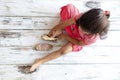 Tender girl putting on her golden slippers