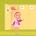 Cute girl putting on jacket in aisle of school, gymnasium or kindergarten locker room