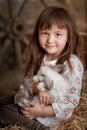 Cute girl with rabbit