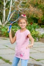 Cute girl with racket Outdoors Royalty Free Stock Photo