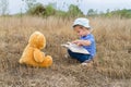 Cute girl reading book Teddy bear Royalty Free Stock Photo