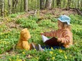 Cute girl reading book Teddy bear Royalty Free Stock Photo