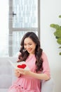 Cute girl reading a love card from her boyfriend Royalty Free Stock Photo