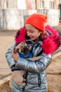 Cute girl relaxing at the park with her pug dog Royalty Free Stock Photo