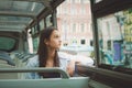 girl rides in the tour bus and looks out the window. Saint Petersburg, Russia.