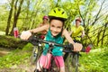 Cute girl riding her mountain bike in the park