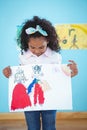 Cute girl showing her drawing Royalty Free Stock Photo