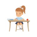 Cute girl sitting at the desk and writing, elementary school student in uniform vector Illustration on a white