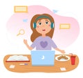 Cute girl is sitting in front of laptop in headphones with food and book on desk