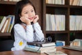 Cute girl sitting in the room feeling tired and headache, children concept, education concept