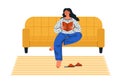 Cute girl sitting on a sofa and reading a book. Royalty Free Stock Photo