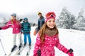 Girl skier skiing with family on mountain Royalty Free Stock Photo