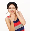 Cute girl smiling with hand covering mouth Royalty Free Stock Photo