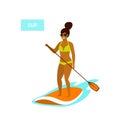 Cute girl stand up paddling in the sea