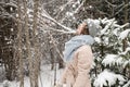 A cute girl is standing under the snow with her eyes closed Royalty Free Stock Photo