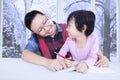 Cute girl studying with her dad at home Royalty Free Stock Photo