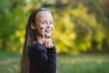 Cute girl sucking on a lollipop candy Royalty Free Stock Photo