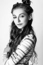 Cute girl teenage with long curly hair posing studio nature portrait. Black and white Royalty Free Stock Photo