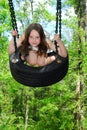 Cute Girl on Tire Swing Royalty Free Stock Photo