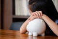 Cute girl tired sleep on piggy bank,saving money concept