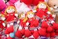 Cute girl toys with plate in hair and red in colour