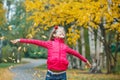 Cute girl walking in the autumn park Royalty Free Stock Photo