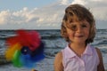 Cute girl with windmill toy Royalty Free Stock Photo