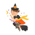 Cute Girl in Witch Halloween Costume, Little Child Flying with Broom , Happy Halloween Party Festival with Kid Trick or Royalty Free Stock Photo