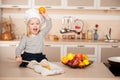 Cute girl with wooden spoon holding apple Royalty Free Stock Photo