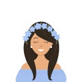 Cute girl in a wreath of blue flax flowers on her head