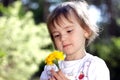 Cute girl with yellow flower