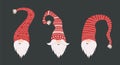 Cute gnomes faces in santa hats on black background. Scandinavian christmas elves. Vector illustration in flat cartoon Royalty Free Stock Photo