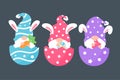 Cute gnomes wearing bunny ears hold carrots and colorful eggs in Easter. Isolated on background Royalty Free Stock Photo