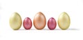 Cute golden and pink metallic Easter eggs isolated on white. Royalty Free Stock Photo