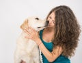 Woman and golden retriever dog over white