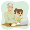Cute granddaughter helping grandfather to use laptop Royalty Free Stock Photo