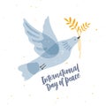 Cute gray translucent dove, pigeon or bird flying and carrying olive branch and International Day of Peace lettering