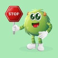 Cute green monster holding stop sign, street sign, road sign Royalty Free Stock Photo