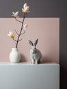 Cute grey bunny sitting near white vase with a branch of spring magnolia flowers. Elegant Easter greeting card. Generative AI Royalty Free Stock Photo