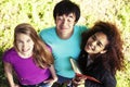 Cute group of teenages in green park at summer with books huggings, diversity nations real students lifestyle Royalty Free Stock Photo