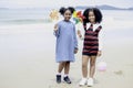 Cute groups of kids have fun together on sandy summer with blue sea, happy childhood friends play on tropical beach,  girl Royalty Free Stock Photo