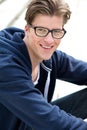 Cute guy smiling with glasses