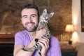 Cute guy and stunning hybrid cat Royalty Free Stock Photo