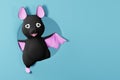 Cute Halloween bat looking from circle frame. 3d render