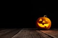 Cute Halloween pumpkin head jack lantern on wooden background Royalty Free Stock Photo
