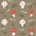 Cute hand drawn cartoon seamless vector pattern illustration with red and white mushrooms and worms on green background Royalty Free Stock Photo
