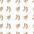 Cute hand drawn seamless pattern with fir tree branches and socks