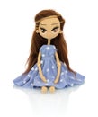Cute handmade crochet doll with speckled blue dress isolated on white background with shadow reflection.