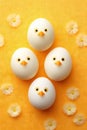 Cute handmade eggs with funny faces and spring flowers on light background. Happy Easter Royalty Free Stock Photo