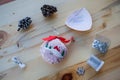 Cute handmade soft toy for Christmas tree in shape of bauble with handmade embroidery. Needlework on Xmas decor. Film